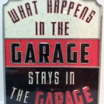 What Happens in the GARAGE Stays in the GARAGE Embossed Tin Sign